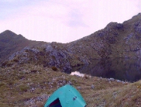 Camping beside an alpine lake.